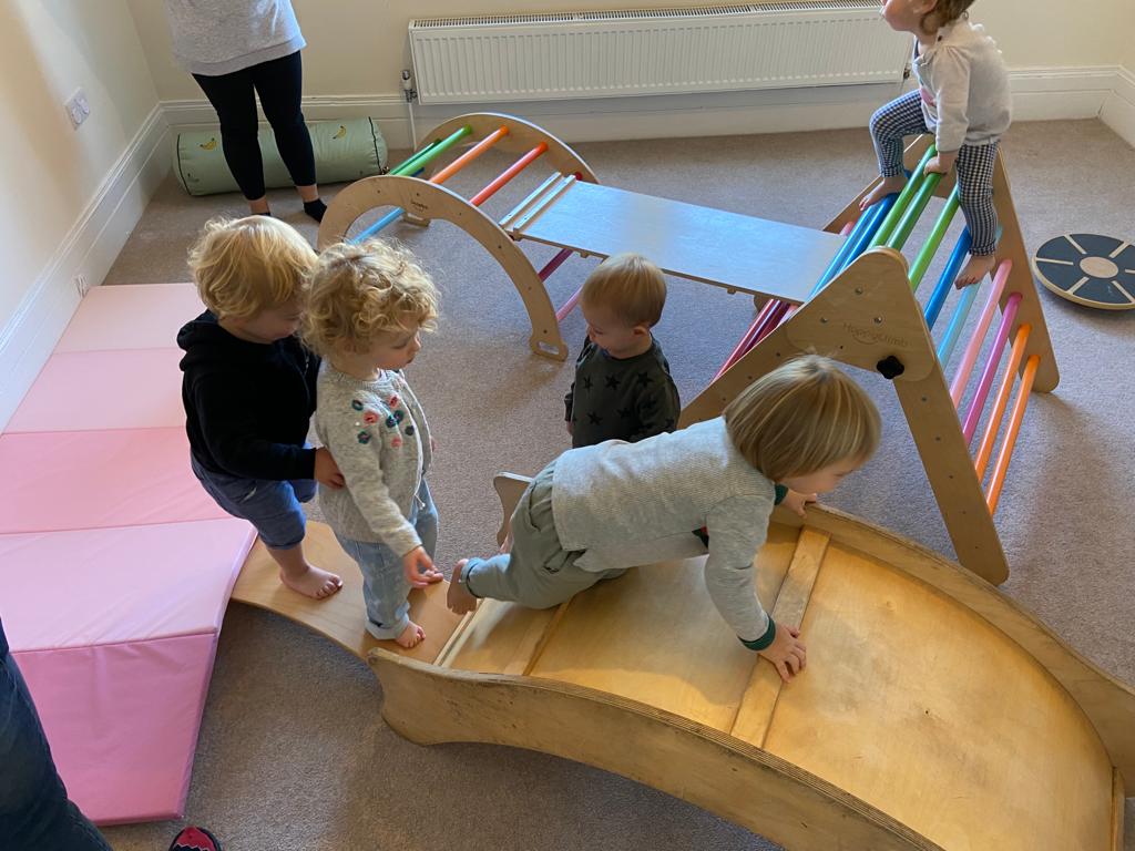 A curious child plays with a set of blocks